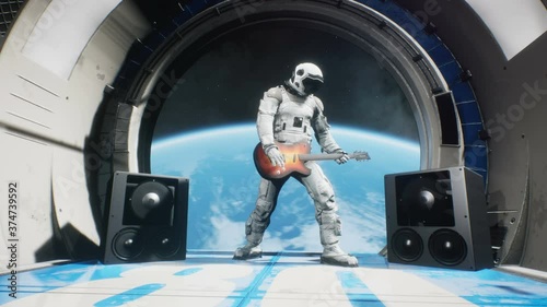 Astronaut on a spaceship playing guitar space rock n roll. Looping animation is designed for fantastic, futuristic or space travel. photo