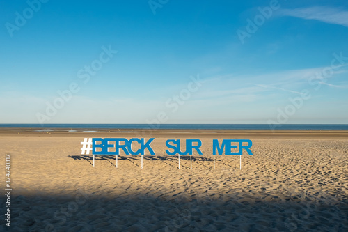 Name sign of the French town of Berck sur Mer in the early morning.