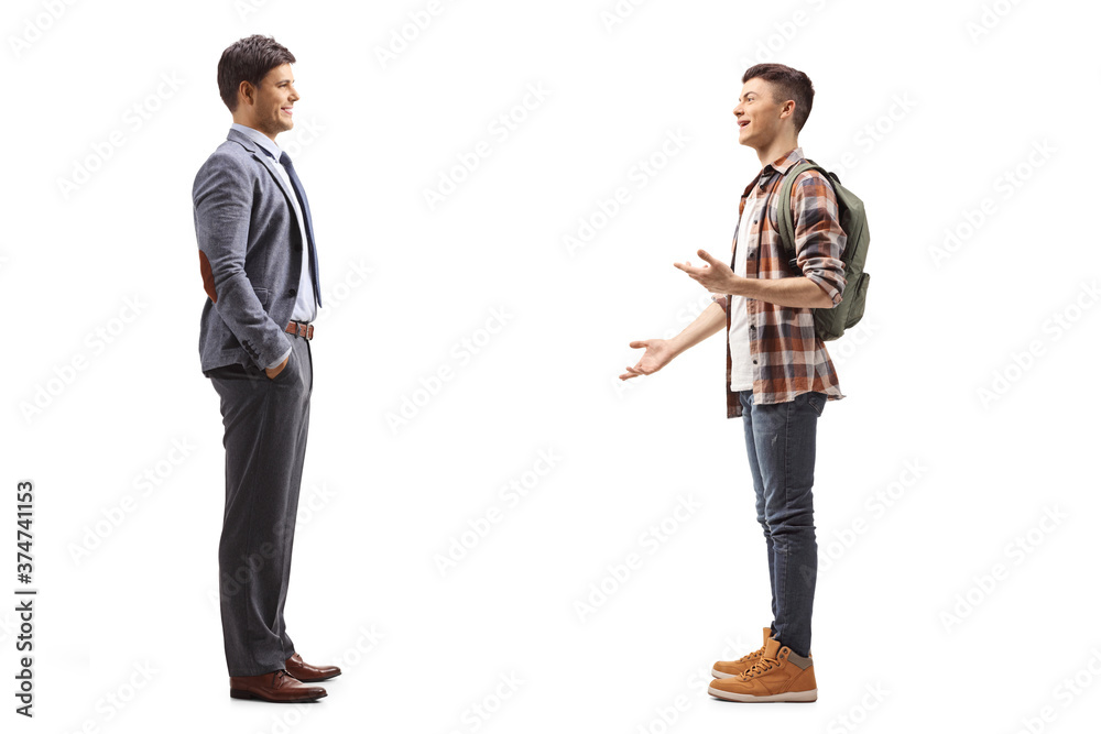 Full length profile shot of a male student talking to a man in a suit Full length profile shot of a male student talking to a man in a suit