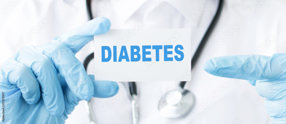 Doctor holding a card with text DIABETES. Medical concept. Doctor holding a card with text DIABETES. Medical concept.