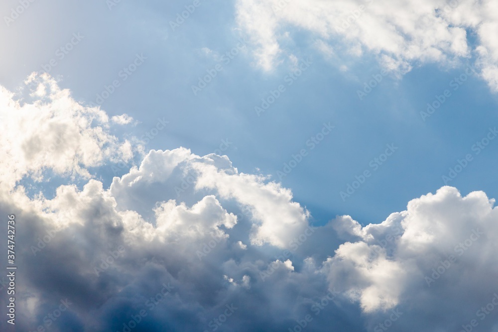 Scenic sky background. Blue sky with fluffy white clouds Scenic sky background. Blue sky with fluffy white clouds