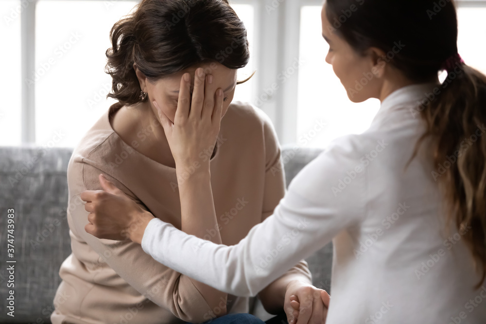 Ταπετσαρία Compassionate kind young woman supporting depressed unhappy middle aged 60s retired mother, giving psychological help, haring advices or comforting at home, trustful family relations concept