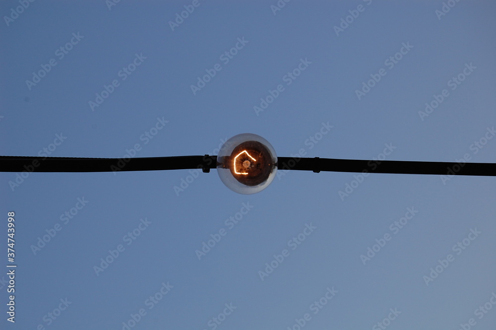 electric lamp on blue sky background electric lamp on blue sky background