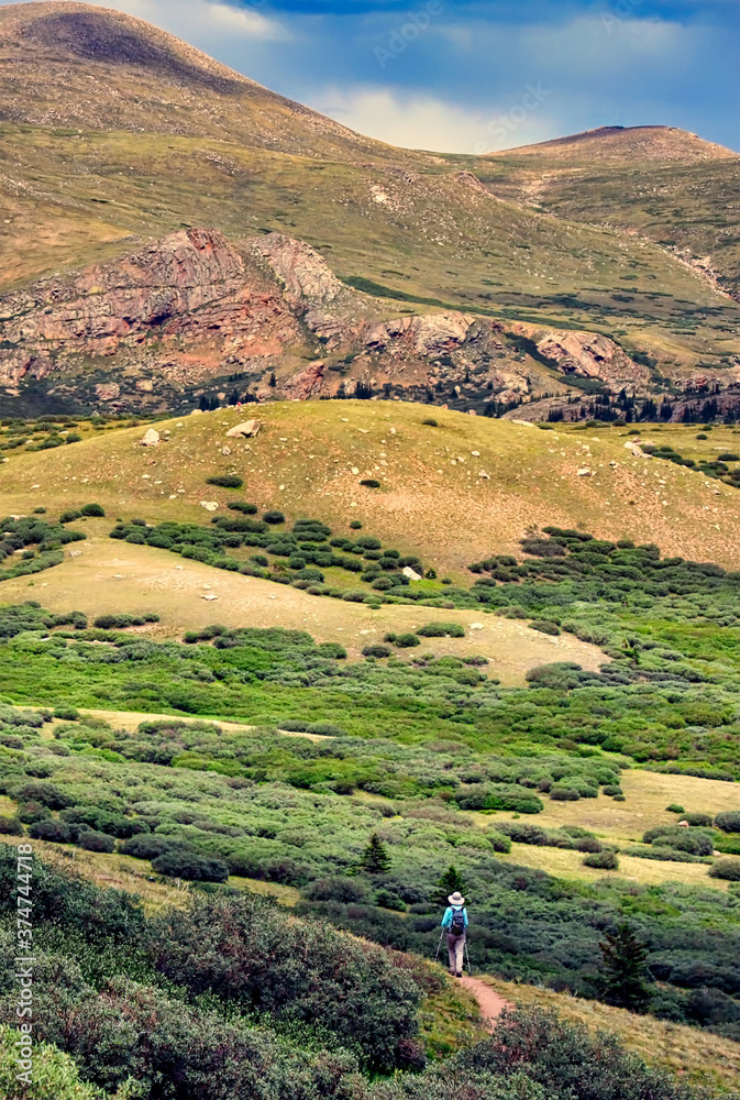 Φωτογραφία Hiker follows a trail above treeline in the Rocky Mountains near Colorado's Guanella Pass