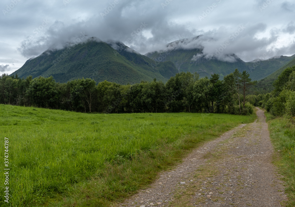 Hike to Trollkirka (Troll church cave), a marble and limestone cave with underground rivers and waterfalls surrounded by a gorgeous forest reserve, Elnesvsgen, Romsdal county, Norway.