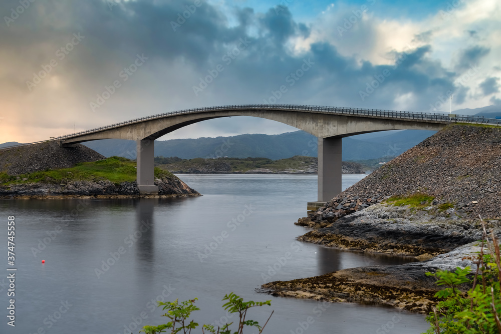 Storseisundet Bridgealong the Atlantic Road that runs through an archipelago in More og Romsdal county, Norway. Built on several small islands and skerries, connected by causeways and bridges. Storseisundet Bridgealong the Atlantic Road that runs through an archipelago in More og Romsdal county, Norway. Built on several small islands and skerries, connected by causeways and bridges.
