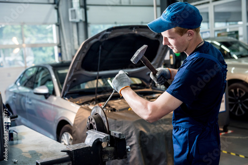 Car mechanic repair car brakes at service station. Car repair service