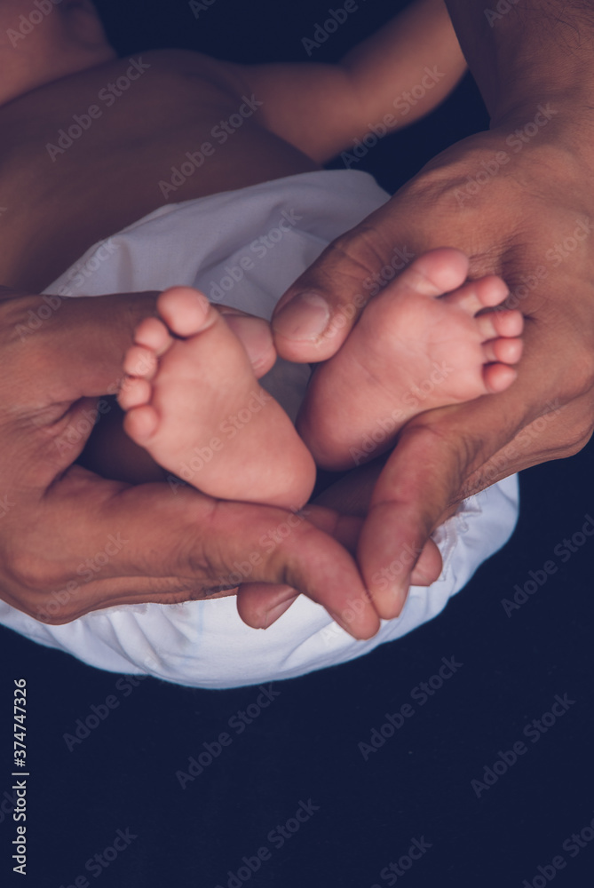 Αυτοκόλλητο Newborn baby feet and hands stock photo royalty free