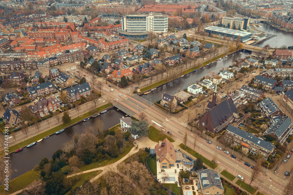 Beautiful aerial Amsterdam view from above with water canals and architecture.
