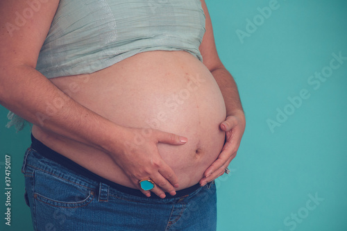 Pregnant woman on a black background 