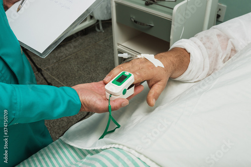 nurse measuring patient circulation