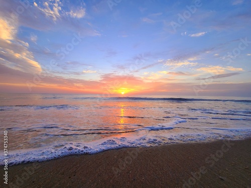 sunset on the beach © Olga