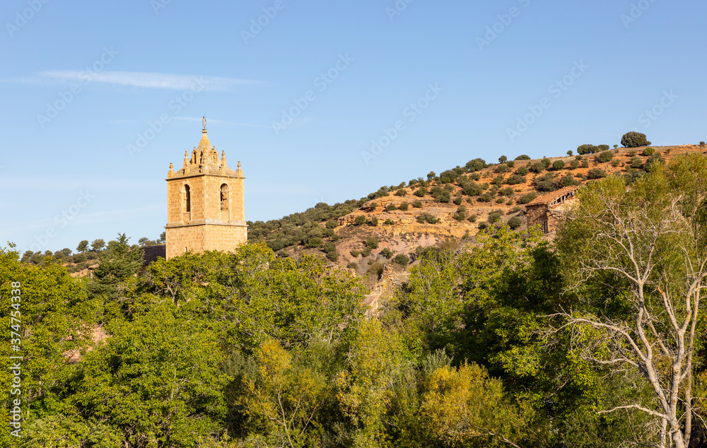 tower of the San Juan Bautista church in Santibanez de Ayllon, province of Segovia, Castile and Leon, Spain
