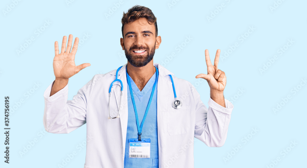 Young hispanic man wearing doctor uniform and stethoscope showing and pointing up with fingers number eight while smiling confident and happy. Young hispanic man wearing doctor uniform and stethoscope showing and pointing up with fingers number eight while smiling confident and happy.