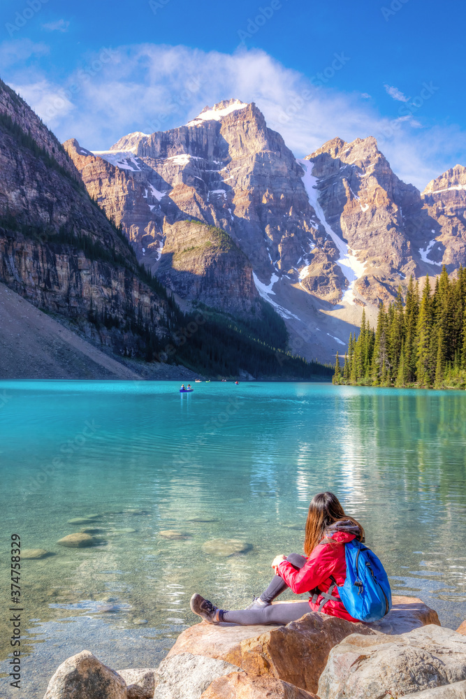 Girl on Moraine Lake in the Canadian Rockies of Banff National Park Girl on Moraine Lake in the Canadian Rockies of Banff National Park