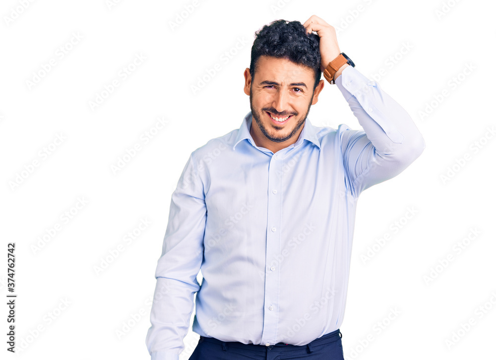 Young hispanic man wearing business clothes confuse and wonder about question. uncertain with doubt, thinking with hand on head. pensive concept. Young hispanic man wearing business clothes confuse and wonder about question. uncertain with doubt, thinking with hand on head. pensive concept.