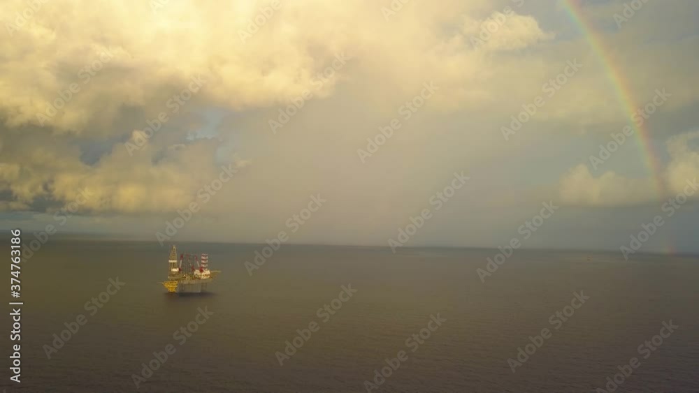 Aerial view from a drone of an offshore jack up rig at the offshore location after the rain with rainbow
Aerial view from a drone of an offshore jack up rig at the offshore location after the rain with rainbow