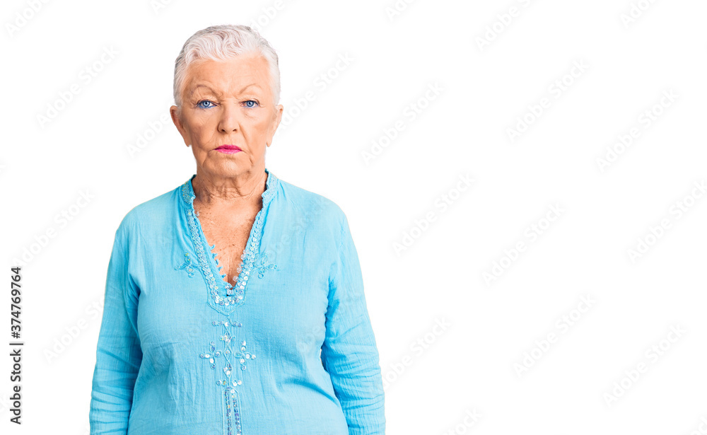 Senior beautiful woman with blue eyes and grey hair wearing summer dress depressed and worry for distress, crying angry and afraid. sad expression. Senior beautiful woman with blue eyes and grey hair wearing summer dress depressed and worry for distress, crying angry and afraid. sad expression.