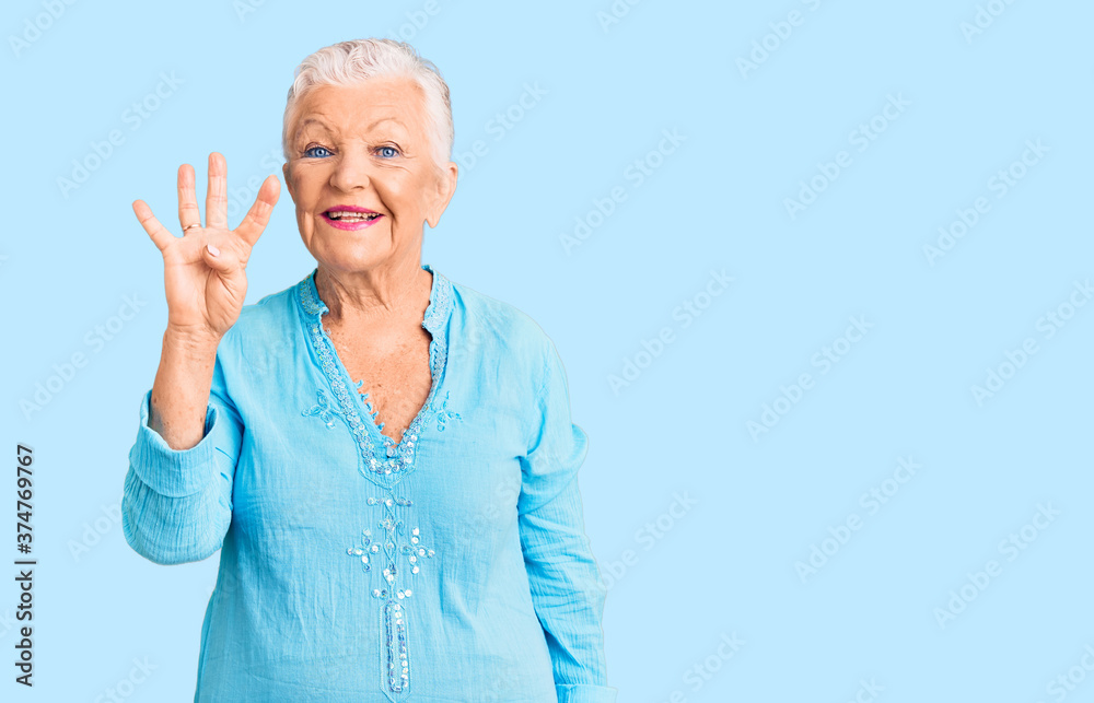 Senior beautiful woman with blue eyes and grey hair wearing summer dress showing and pointing up with fingers number four while smiling confident and happy. Senior beautiful woman with blue eyes and grey hair wearing summer dress showing and pointing up with fingers number four while smiling confident and happy.