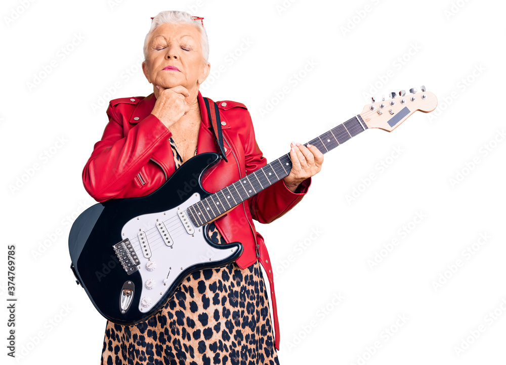 Senior beautiful woman with blue eyes and grey hair wearing a modern look playing electric guitar touching painful neck, sore throat for flu, clod and infection