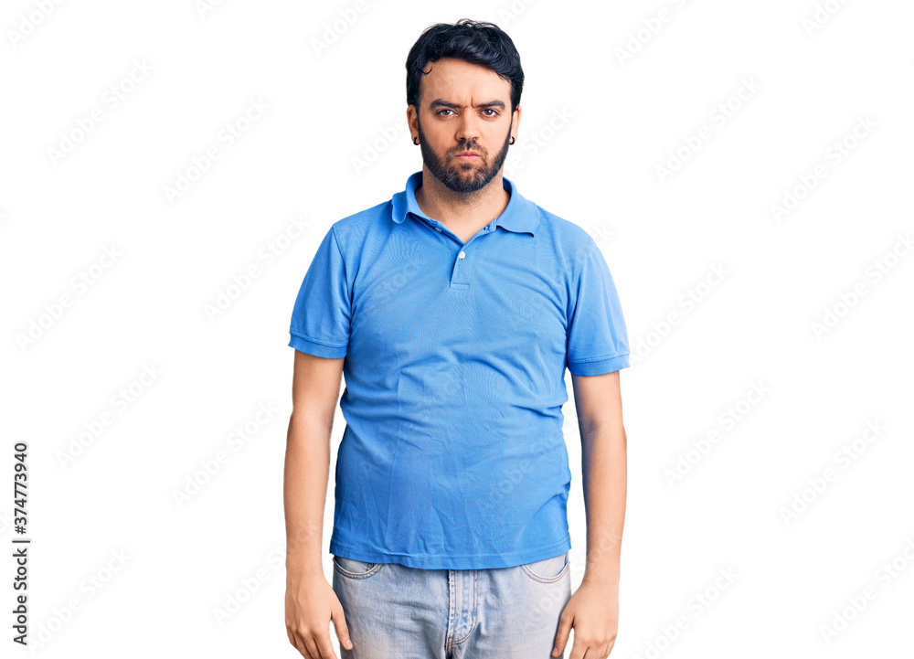 Young hispanic man wearing casual clothes depressed and worry for distress, crying angry and afraid. sad expression. Young hispanic man wearing casual clothes depressed and worry for distress, crying angry and afraid. sad expression.