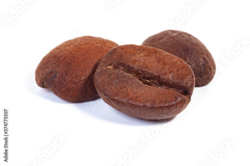 three coffee beans on a white background, isolate