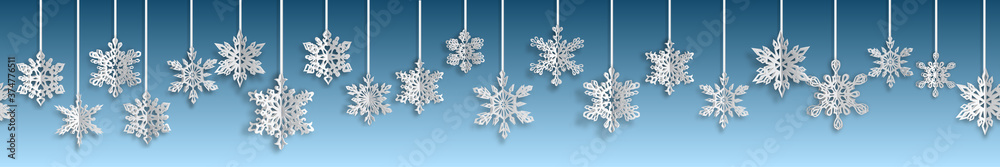 Christmas seamless banner with volume paper snowflakes with soft shadows on light blue background. With horizontal repetition Christmas seamless banner with volume paper snowflakes with soft shadows on light blue background. With horizontal repetition