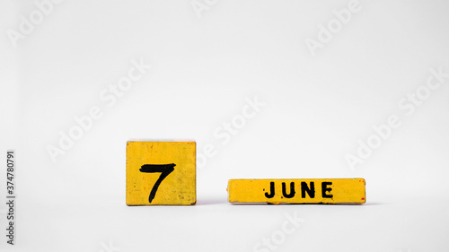 JUNE 7 Wooden calendar. World Food Safety Day. White background with space for your text