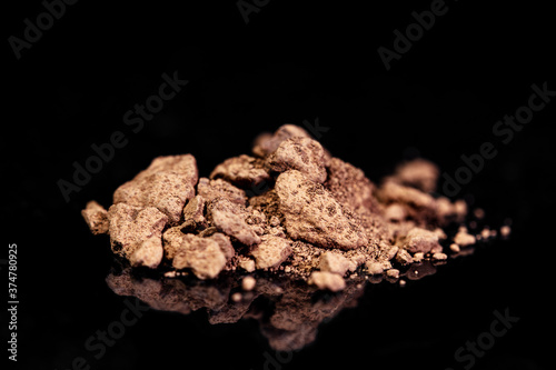 Bauxite ore, raw rocks on black background, mining and geology