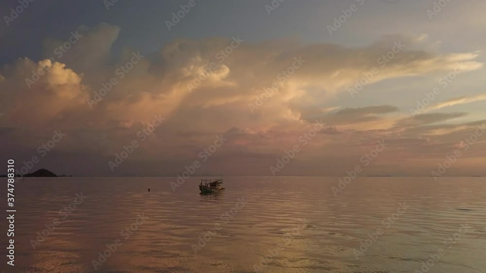 Sunset drone scene of ship wreck and cumulus clouds at koh samui island in Thailand Sunset drone scene of ship wreck and cumulus clouds at koh samui island in Thailand