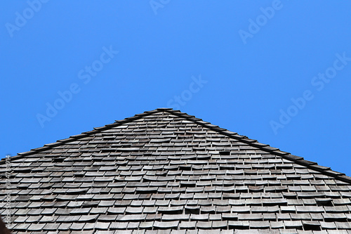 Detail of wooden roof with blue sky