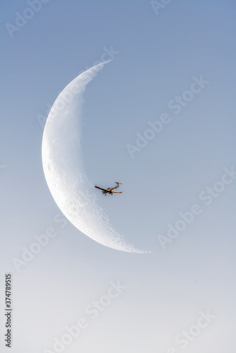 Airplane and the moon