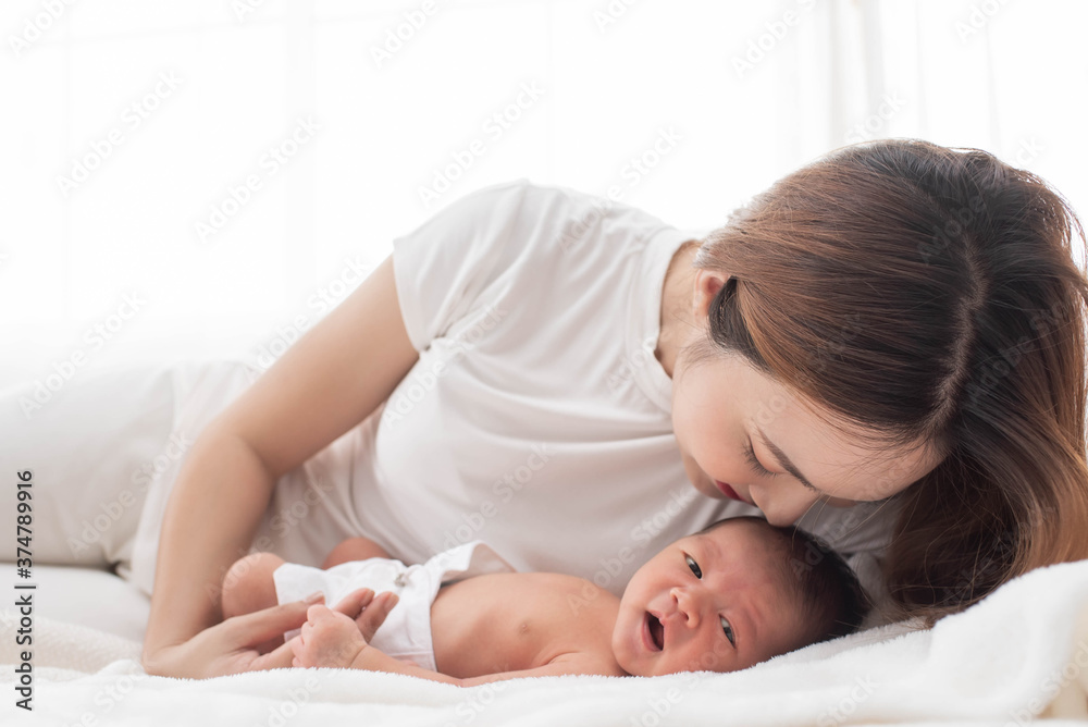woman and new born boy relax. mother breast feeding baby. family at home. happy mother and baby. young mother holding her newborn child. mom nursing baby. mother and baby child on a white bed. woman and new born boy relax. mother breast feeding baby. family at home. happy mother and baby. young mother holding her newborn child. mom nursing baby. mother and baby child on a white bed.