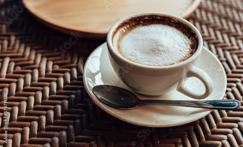 cup of coffee on table in the morning at cafe.