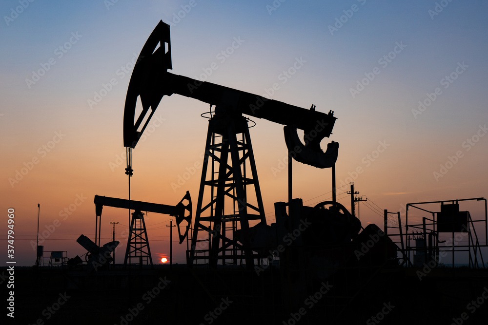 Silhouette of an oil rocking chair at sunset Silhouette of an oil rocking chair at sunset
