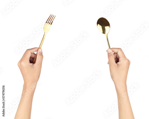 Photography Hand holding Gold plated golden spoon with fork isolated on white background
