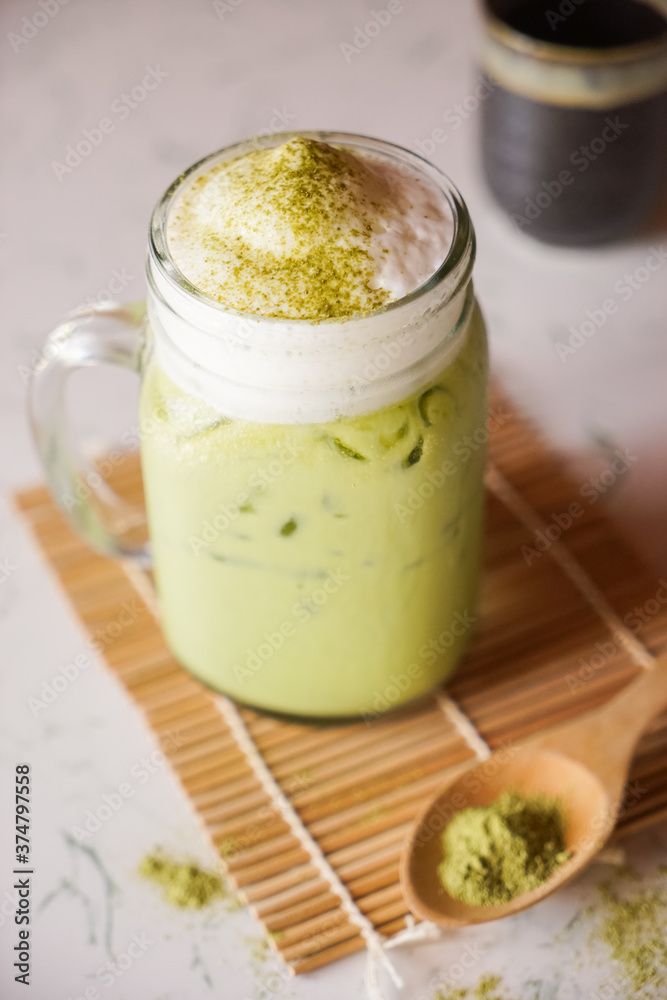 Iced Matcha Green Tea on marble table Iced Matcha Green Tea on marble table
