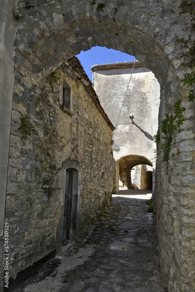 A narrow street among the old houses of Cercemaggiore, a medieval village in the Molise region.