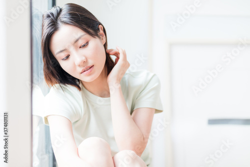 Beautiful young women sitting by the window of Asia