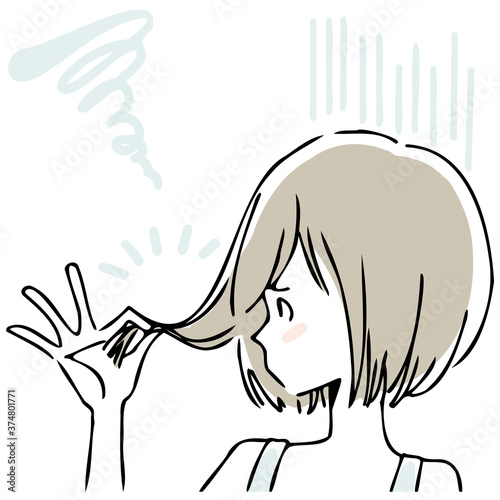 髪のダメージに悩む女性