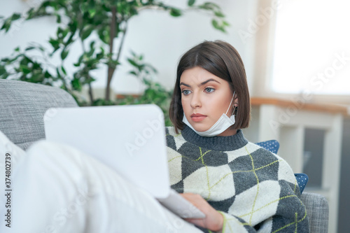 Teenage girl having online classes at home