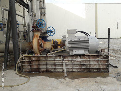 Electric motor and pump on baseplate with new fountation in pulp industial photo