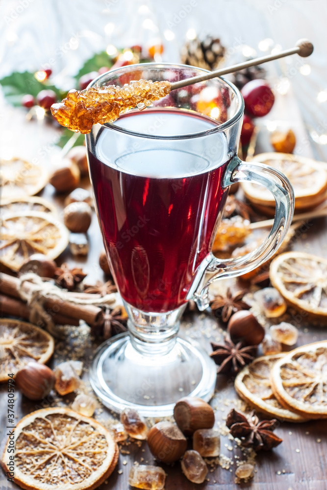 Glass with mulled wine and spices, close up Glass with mulled wine and spices, close up