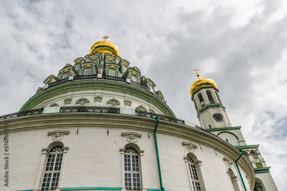 Fototapeta premium Dark clouds over the domes of the monastery