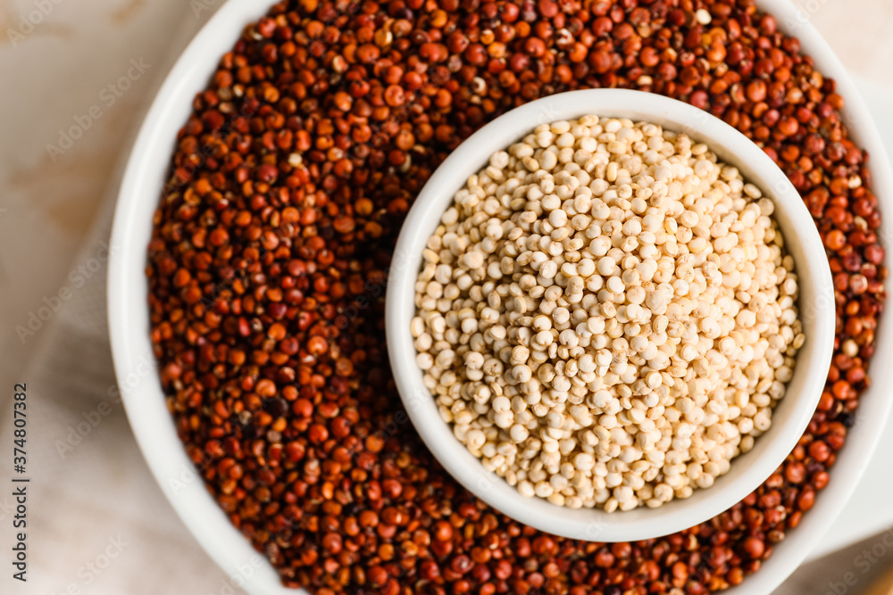 Bowls with healthy quinoa on table, closeup Bowls with healthy quinoa on table, closeup