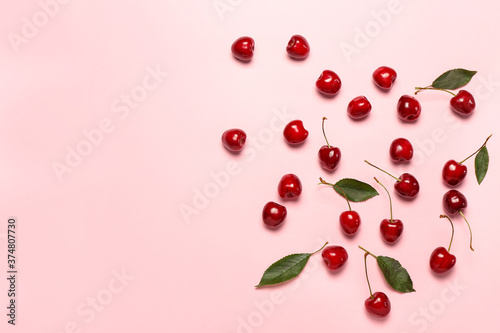 Ripe sweet cherry on color background