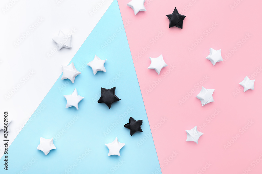 Black and white paper stars on color background. Racism concept Black and white paper stars on color background. Racism concept