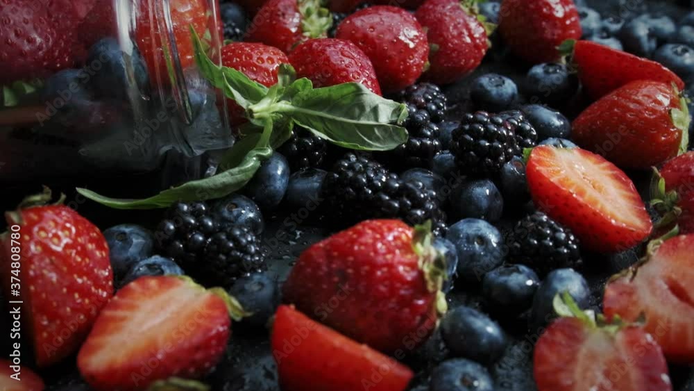 Wild forest berries on black background, collection of strawberry, blueberry and blackberry. Wild forest berries on black background, collection of strawberry, blueberry and blackberry.