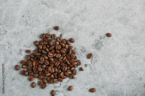 Fresh Coffee Beans on grey concrete background