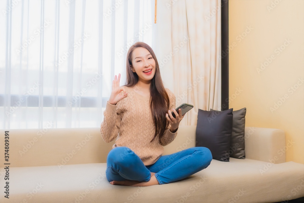 Portrait beautiful young asian woman relax smile happy with smart phone with coffee Portrait beautiful young asian woman relax smile happy with smart phone with coffee